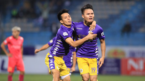Quang Hải (phải) đang thăng hoa, nhưng liệu có thể đưa Hà Nội FC cán đích đầu tiên?	Ảnh: Phan Tùng