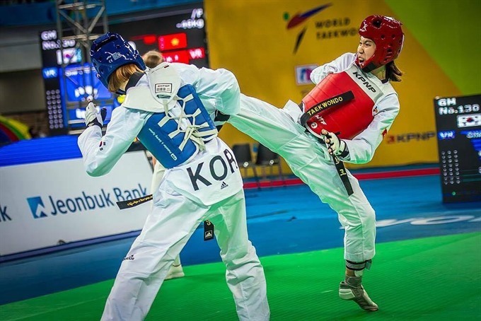 Kim Tuyền (giáp đỏ) là hy vọng huy chương của taekwondo Việt Nam. Ảnh: Đức Cường