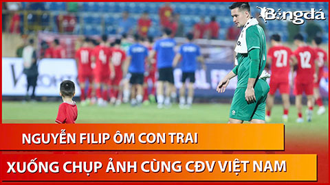 Nguyễn Filip ôm con trai xuống sân Thiên Trường và được CĐV an ủi